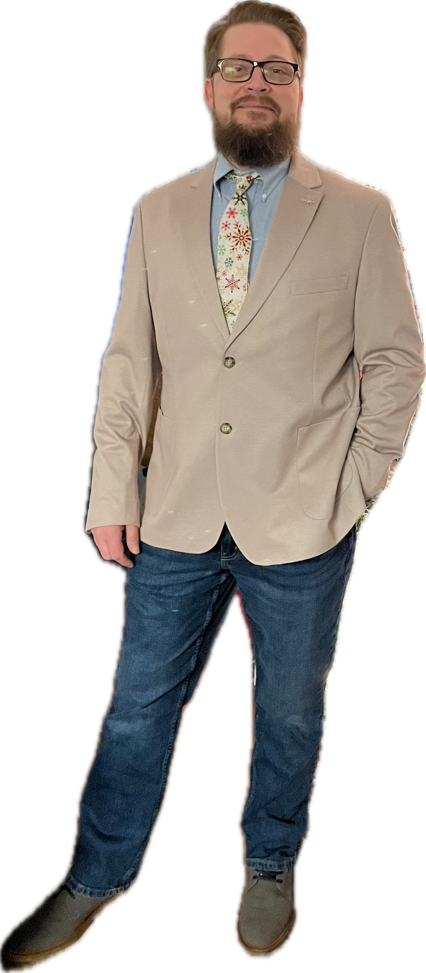 Ben Phillips, in a tan blazer and snowflake-print tie.